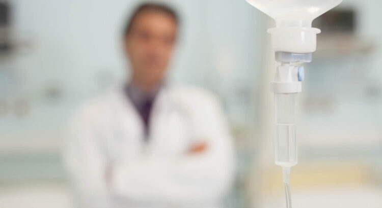 Blurry doctor with syringe representing narcotics