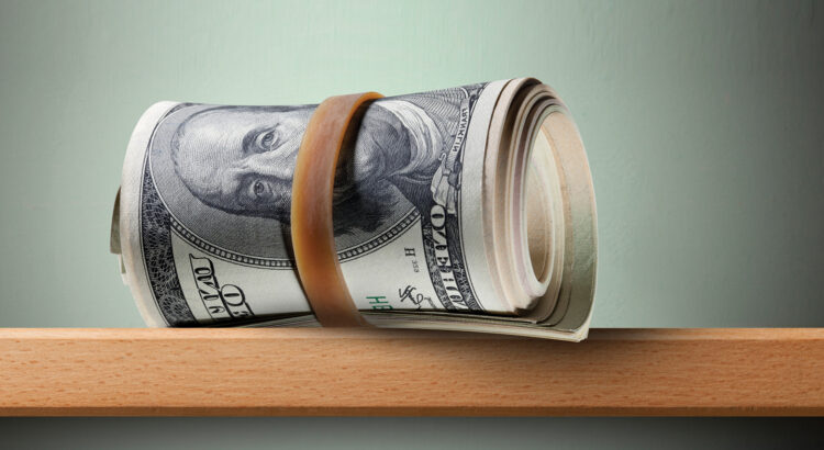 Roll of dollar banknotes