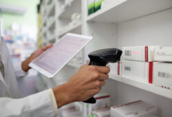 Pharmacist taking inventory